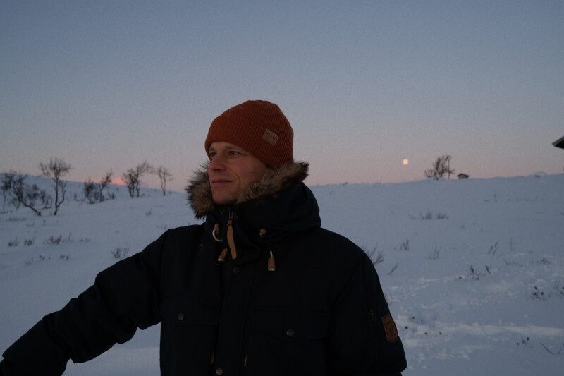 A person standing in wilderness during winter.