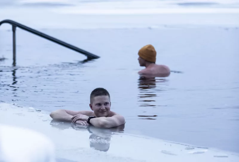 Two persons ice swimming.